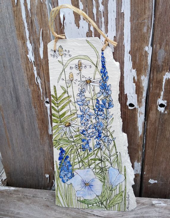 painted slate with blue wildflowers